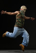 krump style dancer jumping on leg krump style dancer jumping on leg
