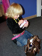Playing with moms handbag and purse