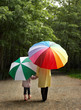 Little girl and her mother in the rain