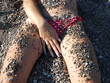 The sexual girl in a pebble on a beach3