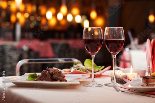 meat with salad and wine