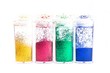 Four colorful glitter bottles separated on white