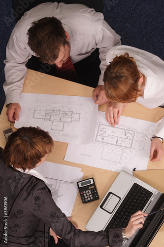 Architect, clients,blueprints