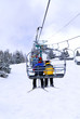 Skiers on chairlift