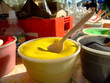 yellow sand with a plastic spoon