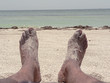 beach - feet lounging in the sand