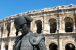 Statue of matador in front of the Roman arena in Nimes, France