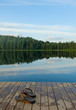 pair of slippers on a pier of the lake