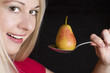 Smiling woman with pear.