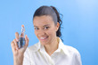 young pretty girl holding perfume