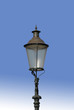 Oldfashioned Electric Lamppost against a blue sky