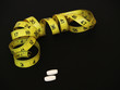 Photo: supplements and tape measure supplements and tape measure