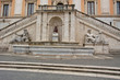 statue below the stairs