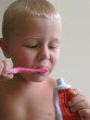 child cleaning teeth