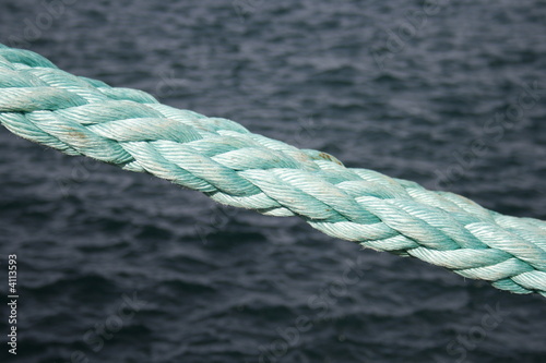 Photo: cotton ships rope against blue sea cotton ships rope against blue sea