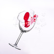 fallen wine glass with red wine in it