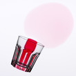 fallen wine glass with red stain on the tablecloth