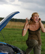 woman with her broken car