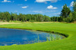 Golf fairway along a pond