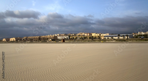 Beach in Spain with properties next to the beach.