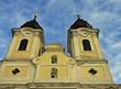 Old yellow church framed by blue cloud spotted sky Old yellow church framed by blue cloud spotted sky