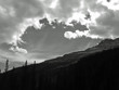 Hole in clouds over rugged mountain Hole in clouds over rugged mountain
