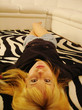 blond lying on a zebra carpet blond lying on a zebra carpet