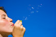 Young Girl blowing bubbles