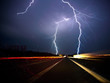 Twin lightning bolts strike highway Twin lightning bolts strike highway