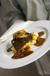 plate of sirloin and potatoes being served