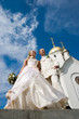 Newlyweds in front of church.