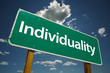 Individuality Road Sign with dramatic clouds and sky.