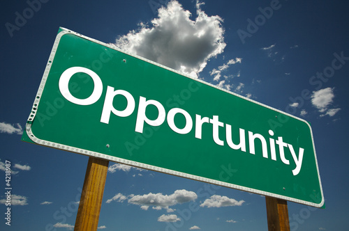 Photo: Opportunity Road Sign with blue sky and clouds. Opportunity Road Sign with blue sky and clouds.