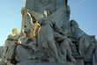 statue of an angel and people