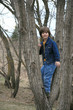 Boy Standing in a Tree