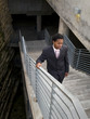 businessman climbing stairs