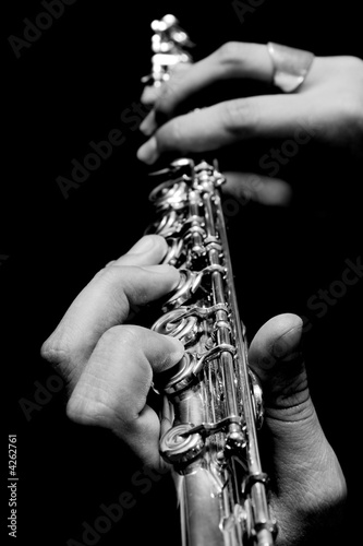 Flute in hands - music concept background