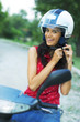 Foto: beautiful happy young girl with helmet on motorcycle beautiful happy young girl with helmet on motorcycle
