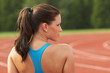 Beautiful Young Woman in Sports Bra Looking Over Shoulder