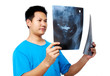 Doctor checking X-ray film
