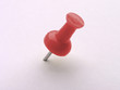 multicolored push pins on white - red