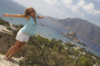 Young woman on the edge to a cliff