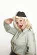 Woman in uniform saluting
