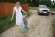 Mother and son giving car a tow Mother and son giving car a tow