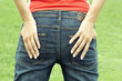 Woman's hands in jeans pocket