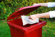 Placing rubbish in recycling bin