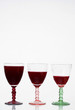 Glasses of red wine on a glass table Glasses of red wine on a glass table