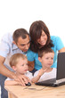 family using laptop