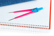 Compass over a notebook Compass over a notebook