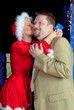 Bussinessman kissed by Santa